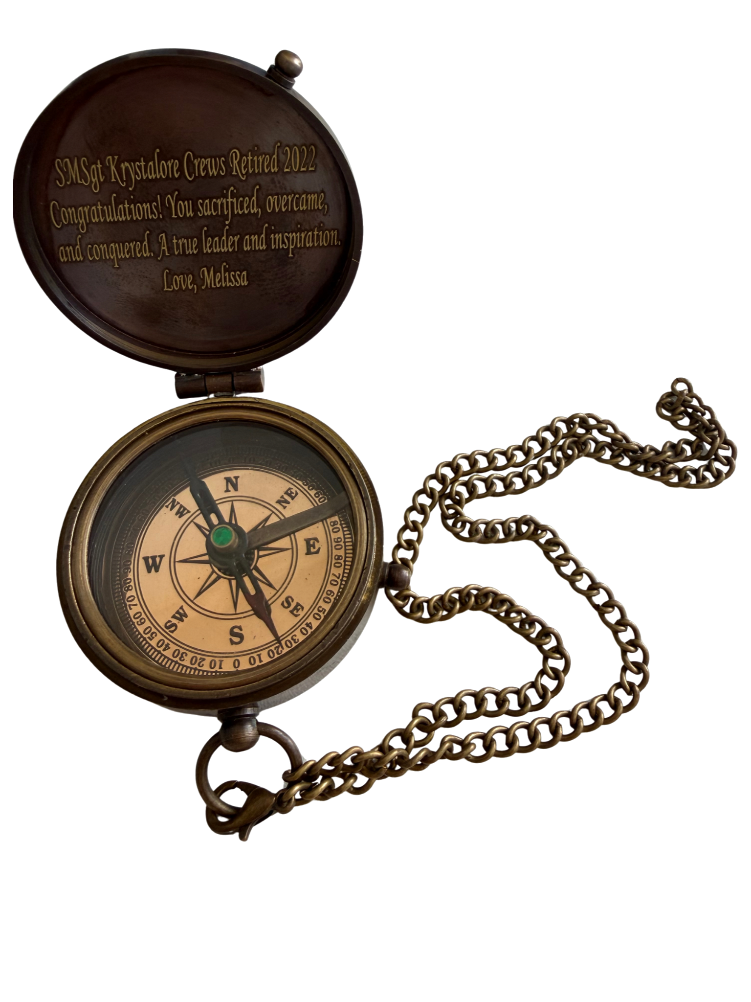 Brass compass given to SMSgt Krystalore Crews on her retirement in 2024 — the symbol of Her Next Mission's True North